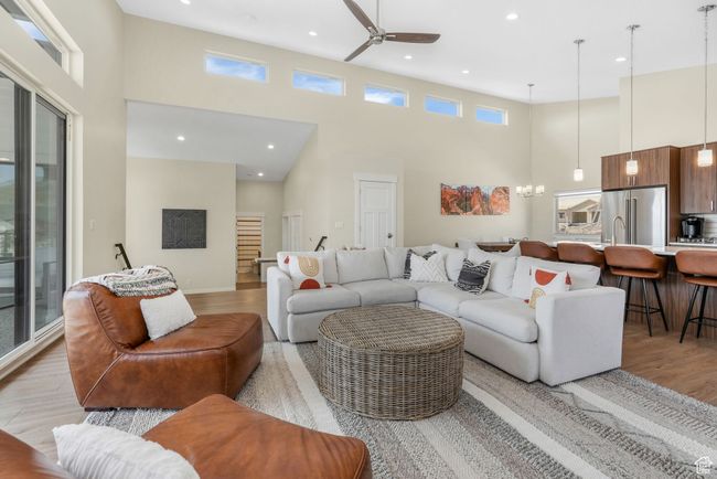 A spacious living room, seamlessly connecting to the kitchen and dining areas. | Image 27