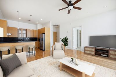 Kitchen Breakfast Bar opening to Living Area -Virtually staged | Image 1