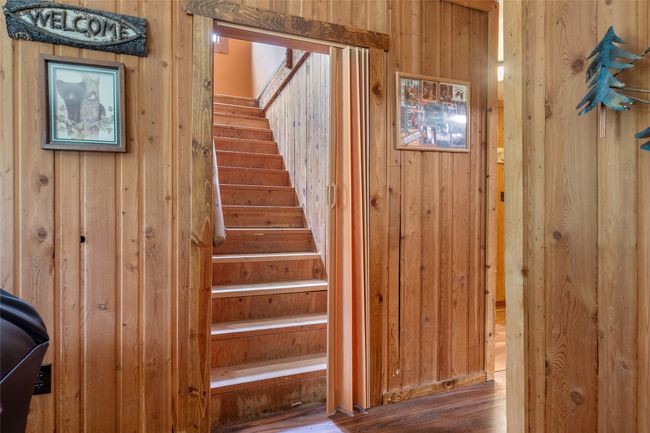 Stairs with wood walls and wood finished floors | Image 55