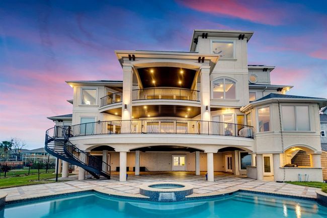 view of the backyard and pool. | Image 8