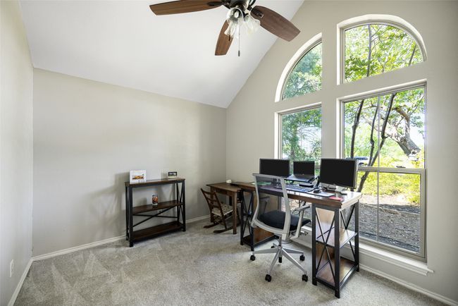 Office with high vaulted ceiling, ceiling fan, carpet flooring, and baseboards | Image 20