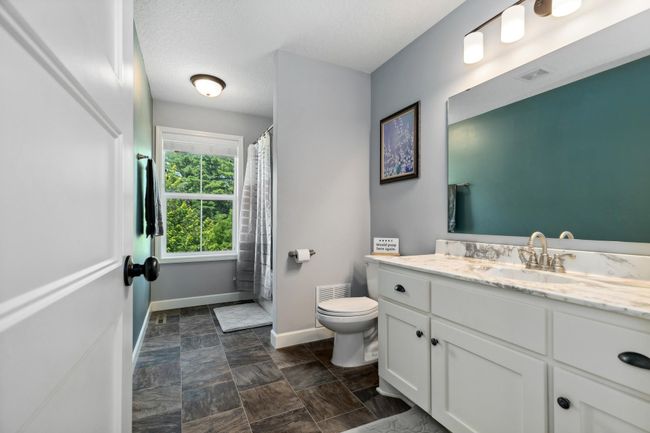 Upper level full bathroom features large window overlooking the Minnesota River Valley. | Image 14