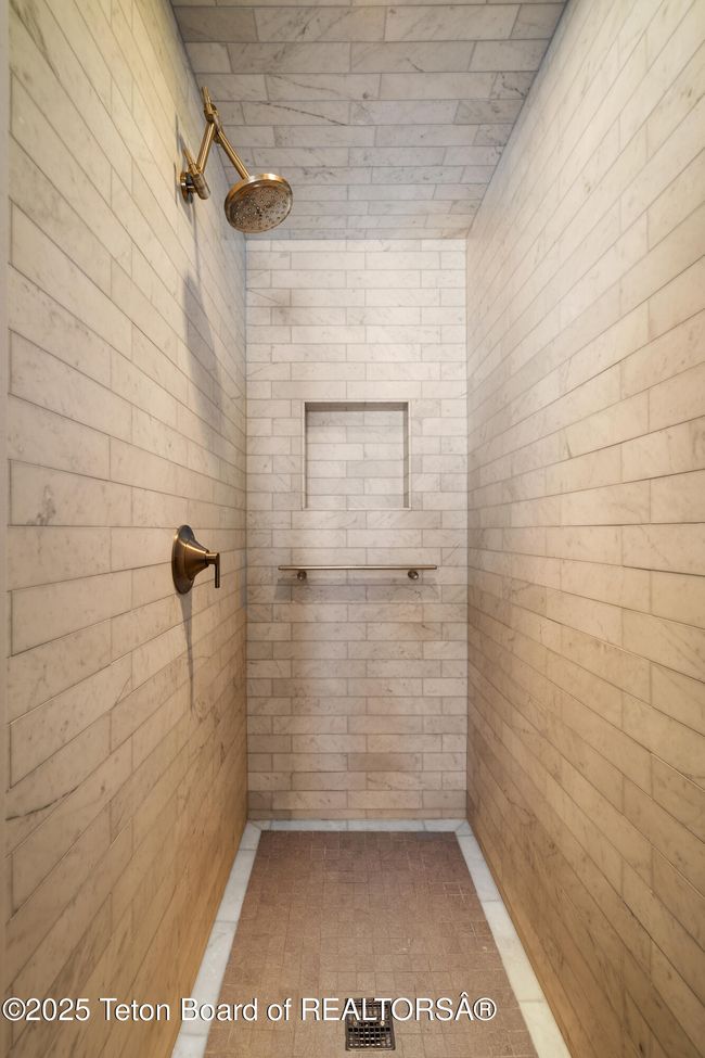 Beautifully tiled oversized shower. | Image 21