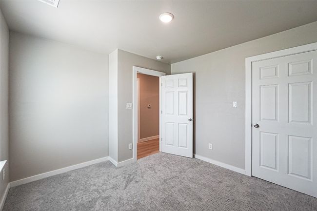 Unfurnished bedroom with carpet flooring and baseboards | Image 21
