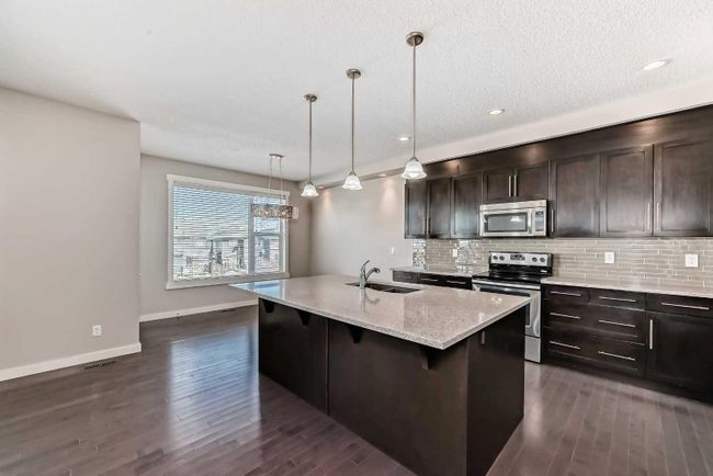 554 Sherwood Boulevard Nw, Home with 6 bedrooms, 3 bathrooms and 4 parking in Calgary AB | Image 3
