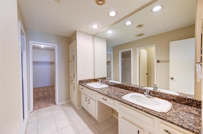Spacious primary bathroom with 2 sinks and ample storage space! | Image 17
