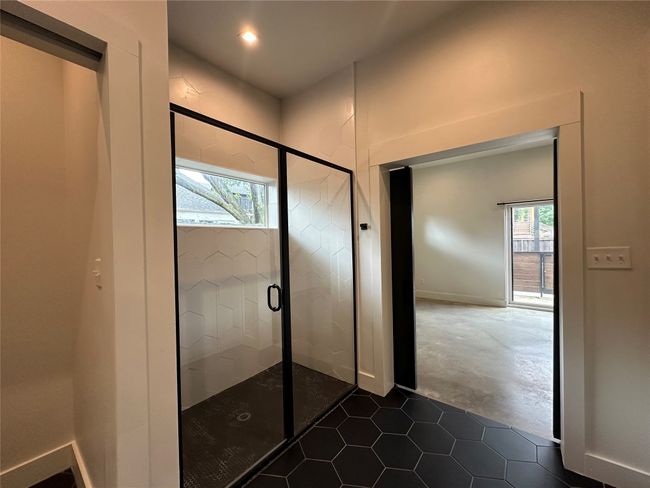 Bathroom featuring a stall shower, tile patterned floors, and recessed lighting | Image 29