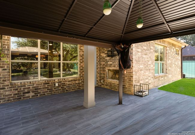 Covered back patio with fireplace | Image 20