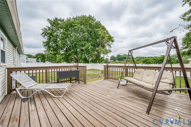 Deck featuring a fenced backyard | Image 20