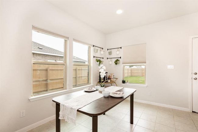 Dining room with baseboards and recessed lighting | Image 17