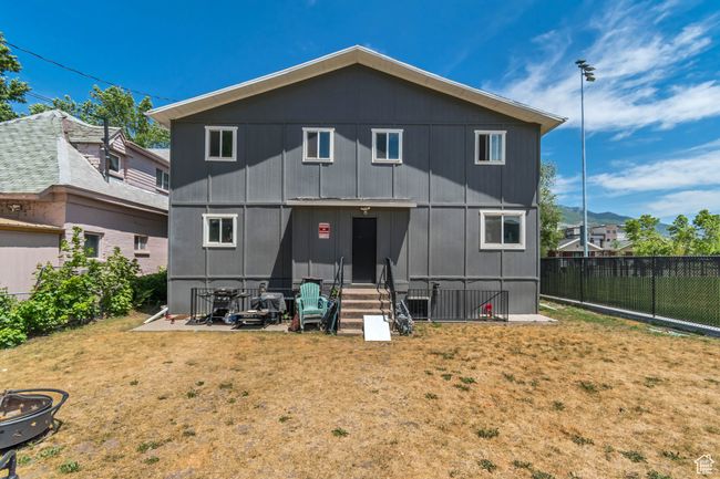 Back of house featuring entry steps and a fenced backyard | Image 15