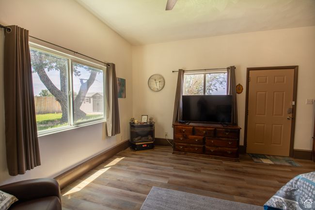 Living room with wood finished floors and baseboards | Image 16