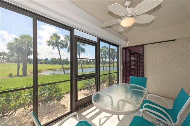 Sunroom with a water view, healthy amount of natural light, and ceiling fan | Image 24