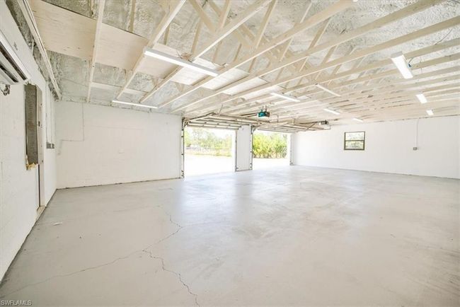 Garage with a garage door opener | Image 43