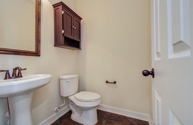 Half bath located downstairs for guests. | Image 35