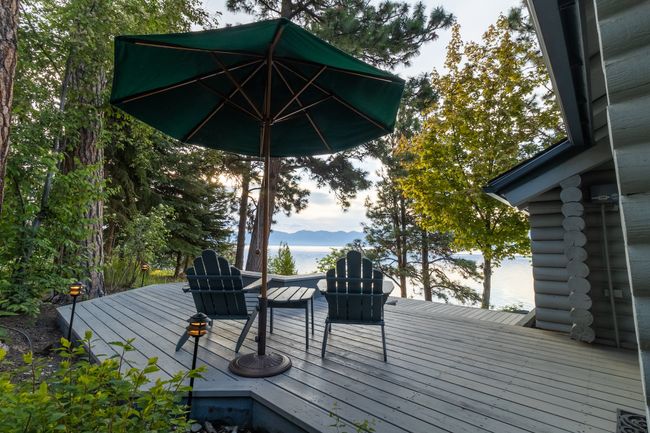 Deck with a water and mountain view | Image 50
