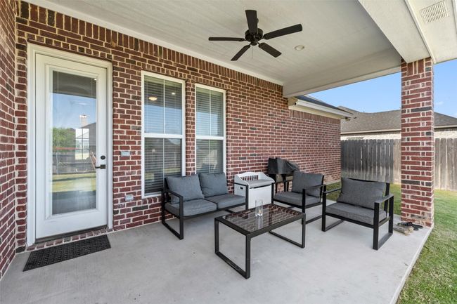 View of patio / terrace featuring ceiling fan, fence, and an outdoor hangout area | Image 20