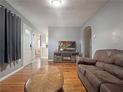 Living room with light hardwood / wood-style floors | Image 3