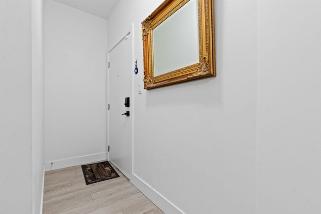 Entryway featuring light wood finished floors and baseboards | Image 26