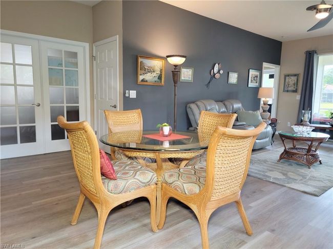 Dining room featuring french doors and wood finished floors | Image 16