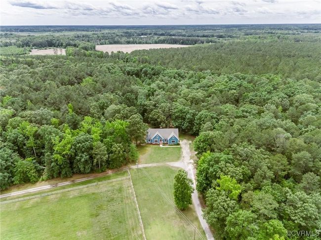 View of subject property featuring a heavily wooded area | Image 5