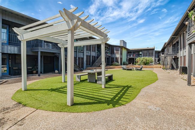 Surrounding community featuring stairs, a pergola, and a lawn | Image 16