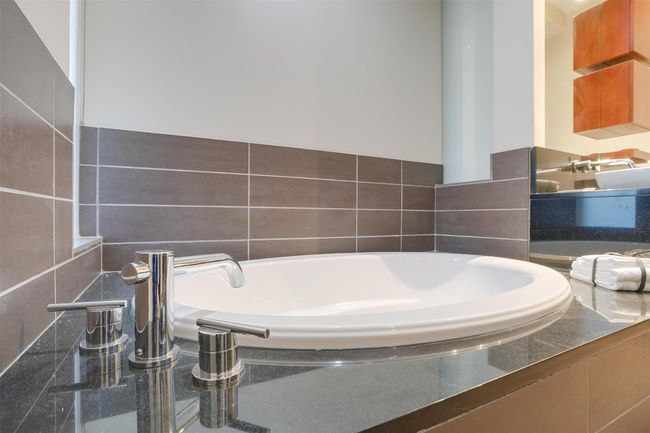 Bathroom featuring a garden tub | Image 35