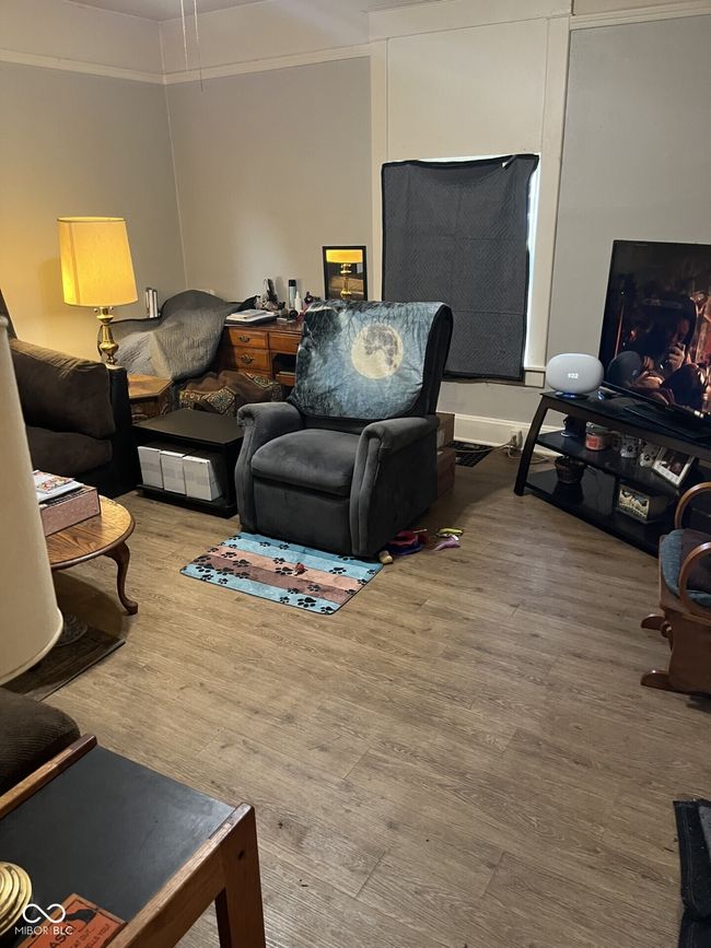 living area featuring wood finished floors | Image 14
