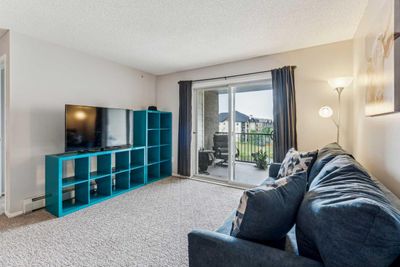 6408 - 304 Mackenzie Way Sw, Condo with 2 bedrooms, 2 bathrooms and 1 parking in Airdrie AB | Image 1