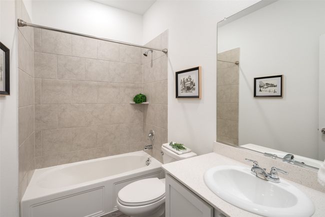 Full bathroom featuring tub / shower combination, toilet, and vanity | Image 18