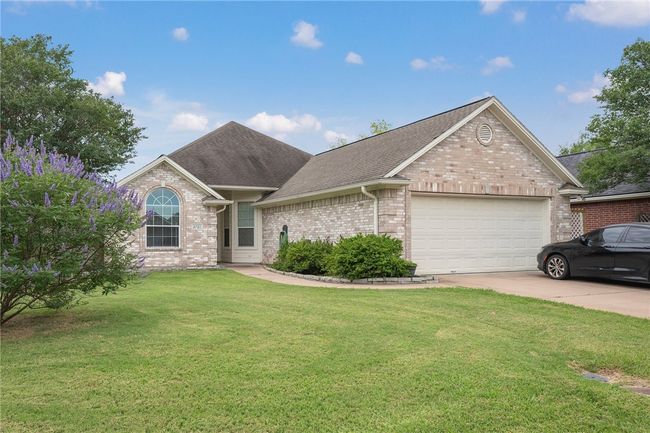 Ranch-style house featuring an attached garage, brick siding, a front lawn, driveway, and roof with shingles | Image 16