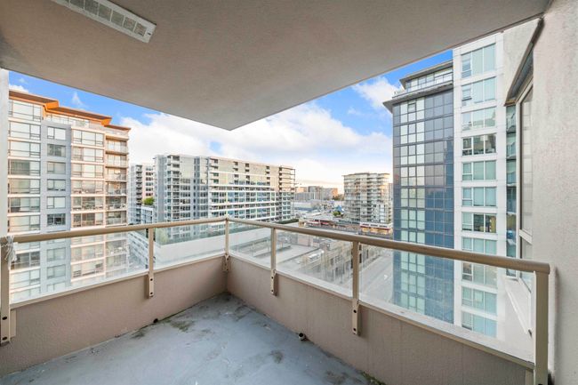 Balcony featuring a view of city and visible vents | Image 18