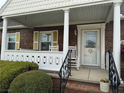 View of exterior entry with a porch | Image 2