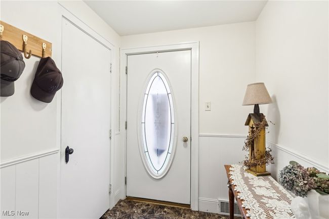 Entryway featuring wainscoting and visible vents | Image 4