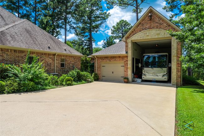 View of side of property featuring a garage and a yard | Image 32