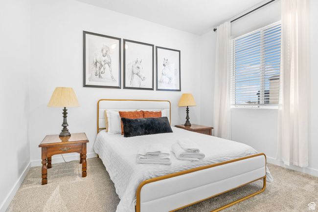 Carpeted bedroom featuring baseboards | Image 16