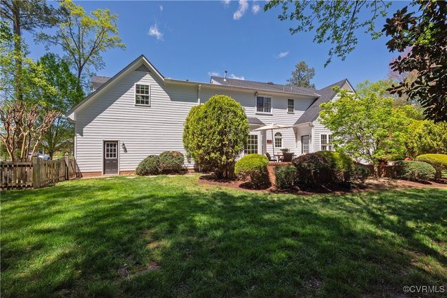Back of property with a yard and fence | Image 42