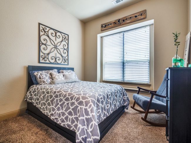 Bedroom with dark carpet and baseboards | Image 17
