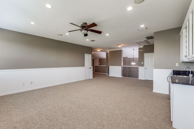 Upstairs features large gameroom with wet bar | Image 27