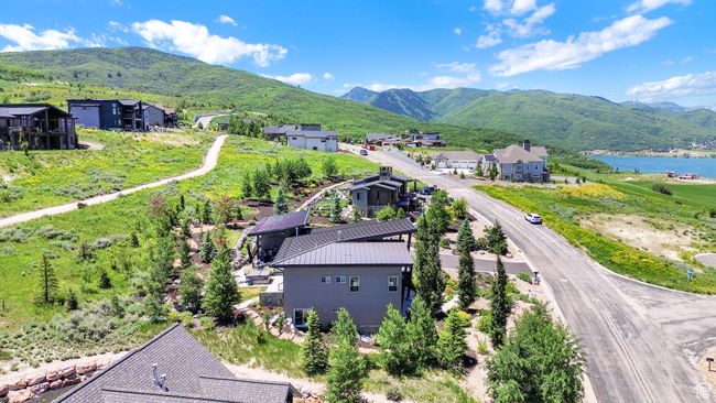 Aerial view of residential area featuring a water and mountain view | Image 120