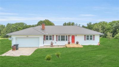 Single story home with a garage and a front lawn | Image 3