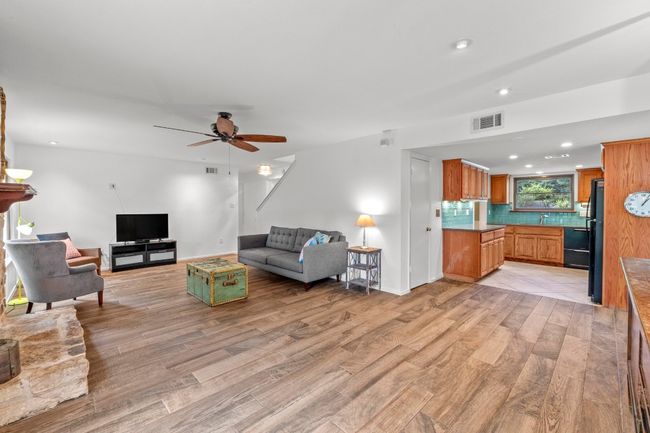 The living room opens effortlessly to the kitchen, creating a natural flow that works just as well for quiet evenings as it does for lively gatherings | Image 6