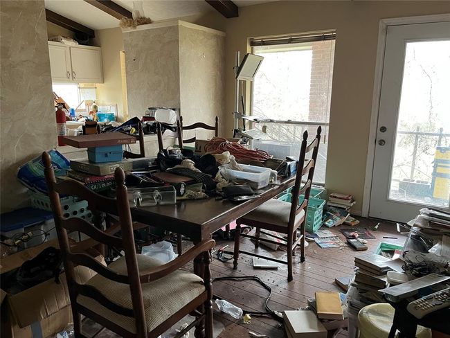 The dining room upstairs. The door leads to a balcony overlooking the back yard. Chocolate Bayou is out there somewhere. | Image 34