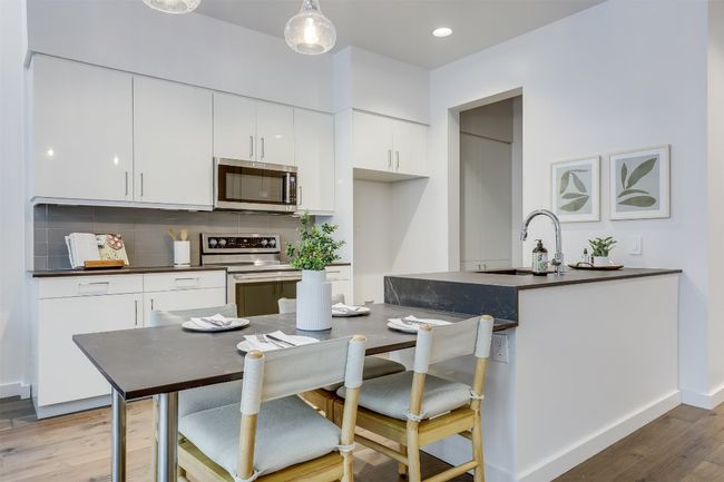 The kitchen includes abundant countertop space, offering plenty of room for meal prep and entertaining | Image 17