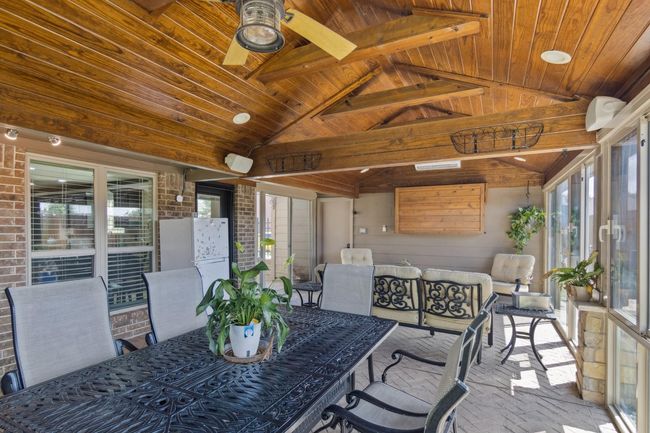 Beautiful enclosed patio with brick floors. | Image 36