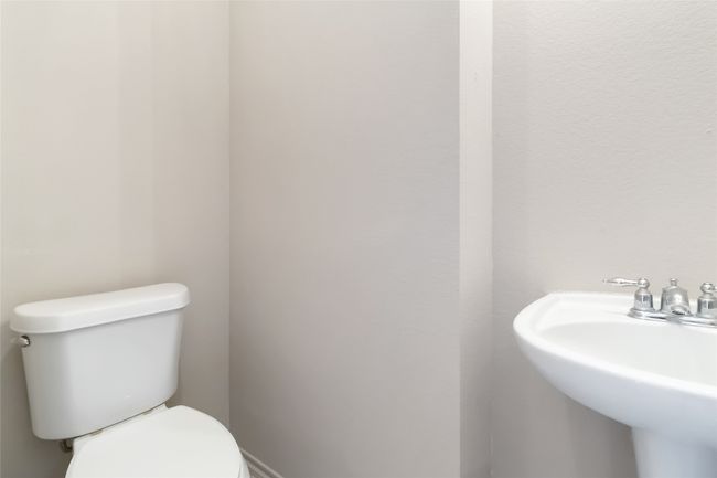 Half bathroom featuring a sink and toilet | Image 18