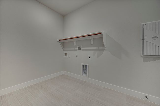 Clothes washing area with hookup for an electric dryer, baseboards, gas dryer hookup, washer hookup, and laundry area | Image 16