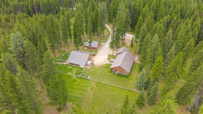 View from above of property with a heavily wooded area | Image 16