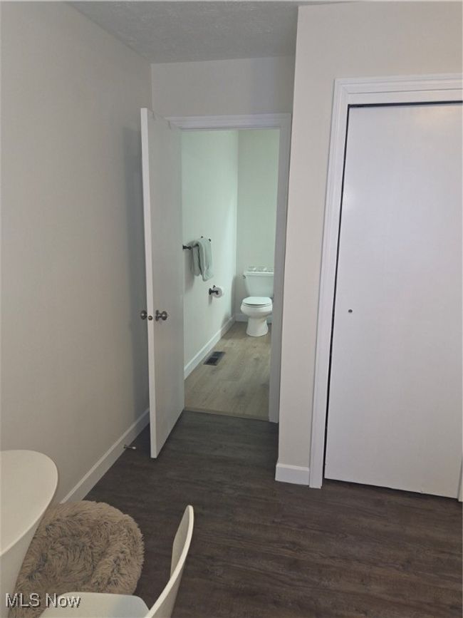 Bathroom with visible vents, toilet, wood finished floors, and​​‌​​​​‌​​‌‌​‌‌​​​‌‌​​‌‌​‌​​​​​‌ baseboards | Image 17