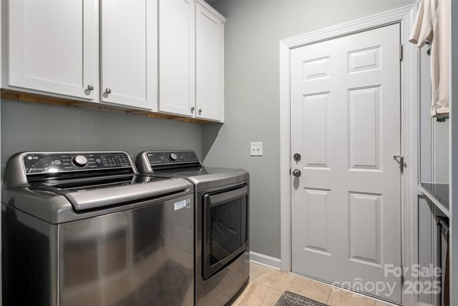 Added upper cabinets to laundry room | Image 25